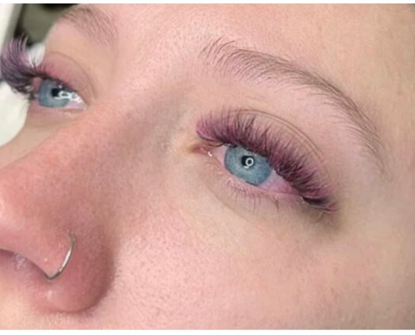 Pink and purple colored eyelash extensions