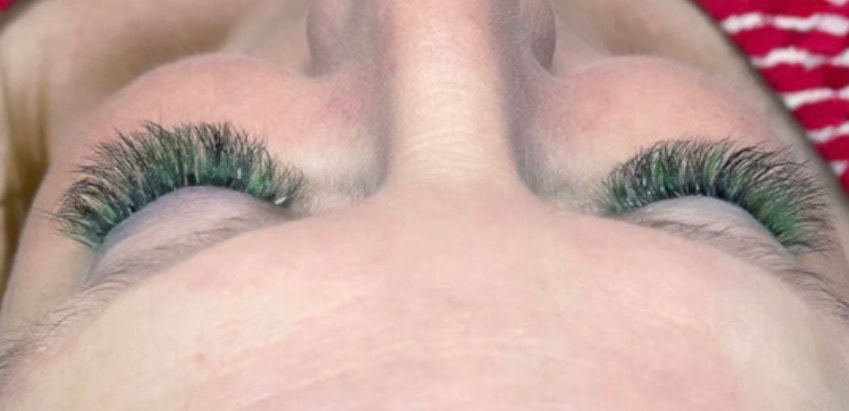 Green colored lash extensions overhead view