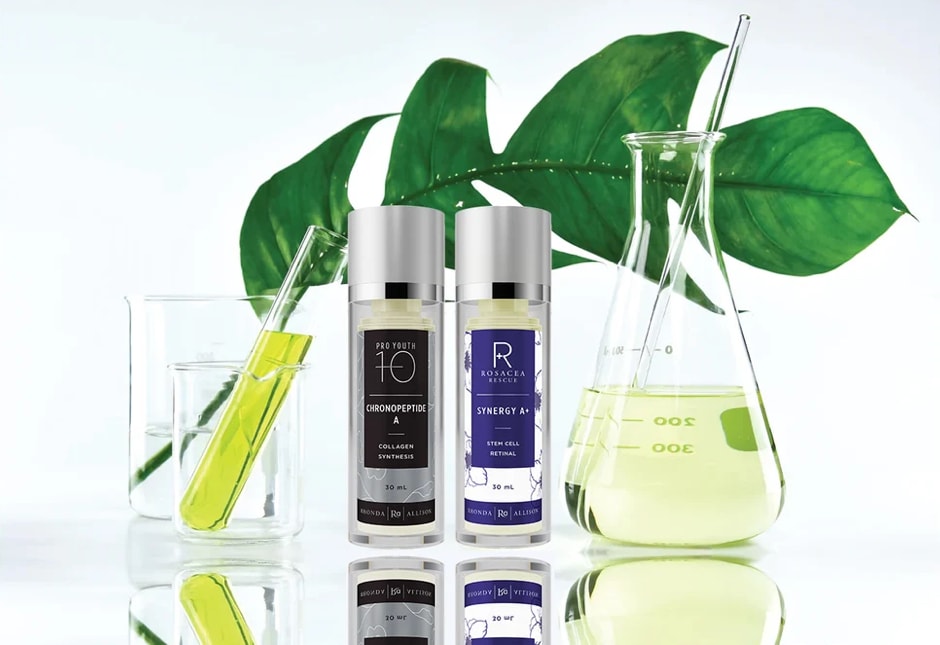Rhonda Allison Pro Youth and Rosacea Rescue skincare products with botanical ingredients and scientific glassware